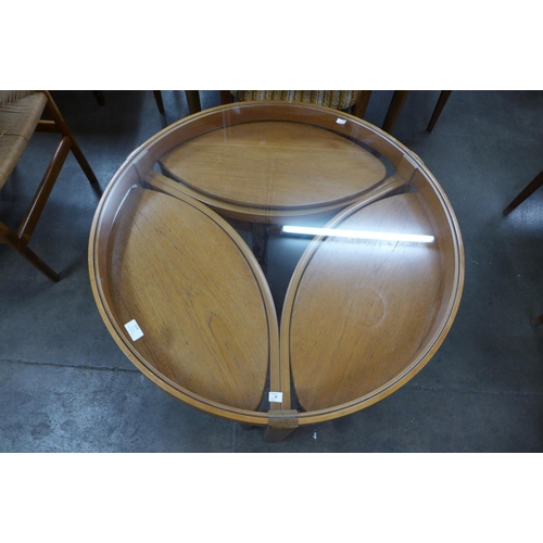 159 - A Nathan teak and glass topped circular nest of tables