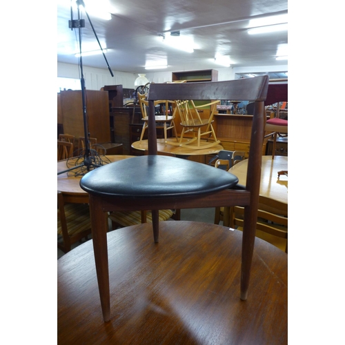 161 - A Danish Frem Rojle teak roundette table and four chairs, designed by Hans Olsen