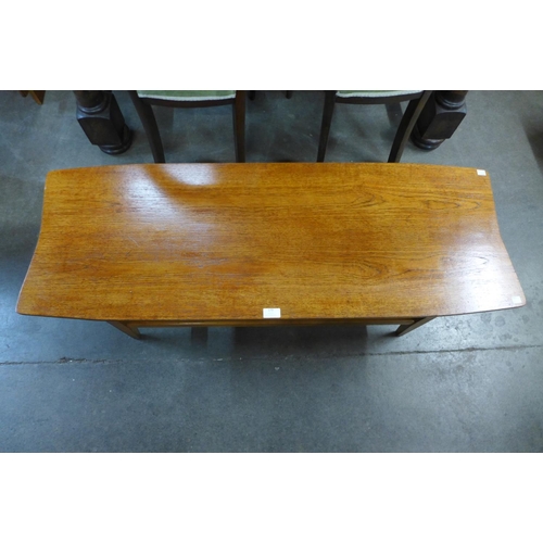 179 - A teak coffee table