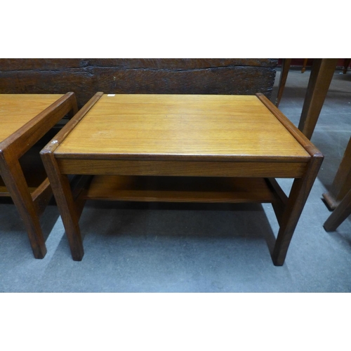 180 - A pair of teak occassional tables