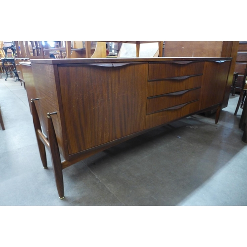 181 - A teak and afromosia sideboard