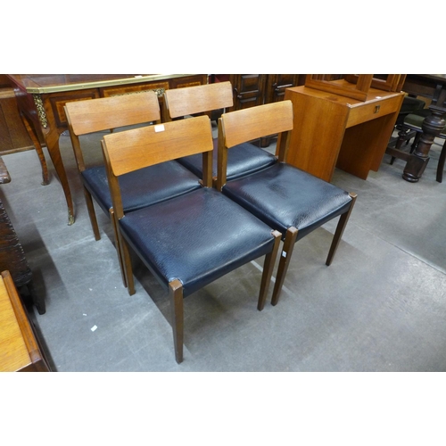 184 - A set of four teak and vinyl chairs