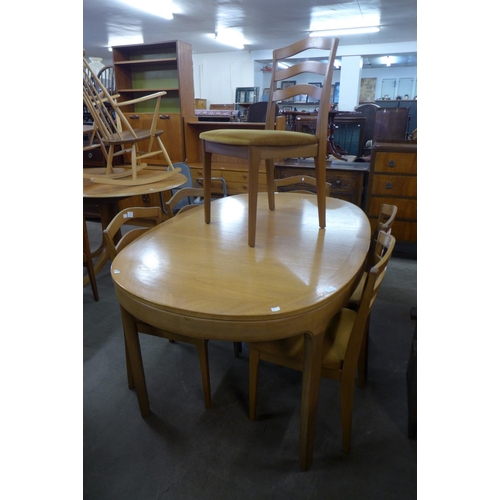 187 - A teak dining table and six chairs