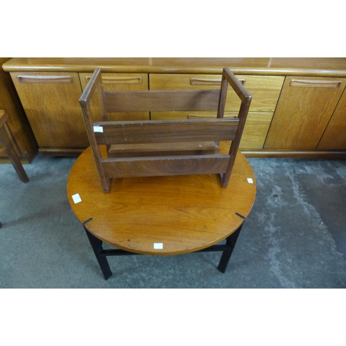 204 - A circular teak occasional table and a magazine rack