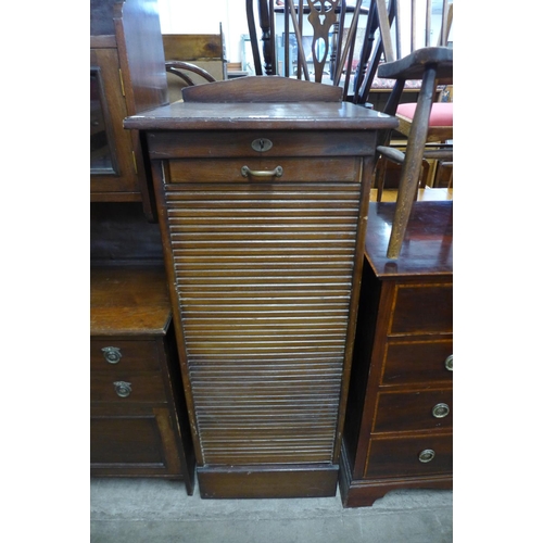 213 - An oak tambour front filing cabinet