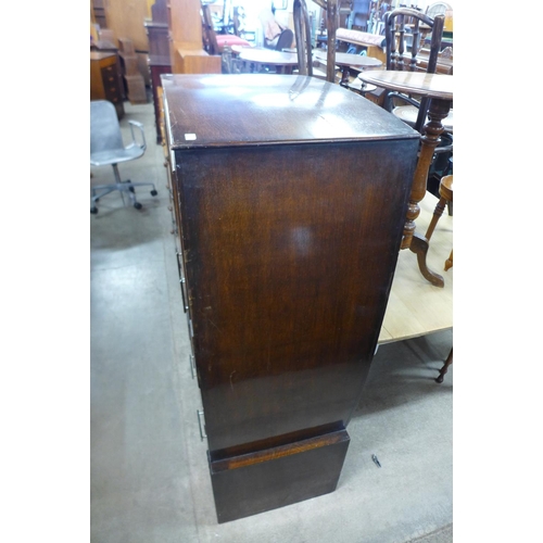 218 - An Art Deco oak tallboy