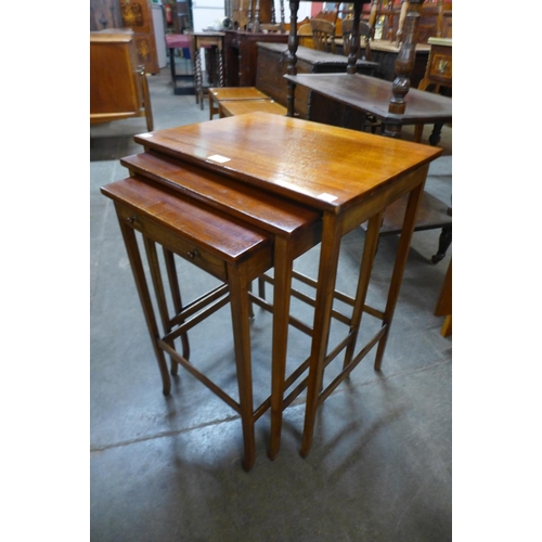 219 - An Edward VII mahogany nest of tables with single drawer