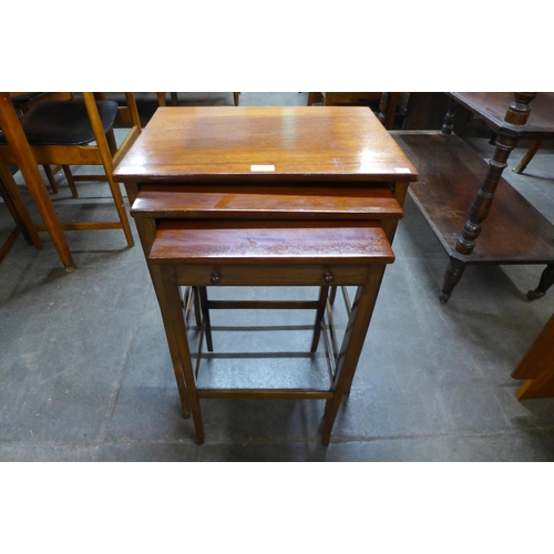 219 - An Edward VII mahogany nest of tables with single drawer