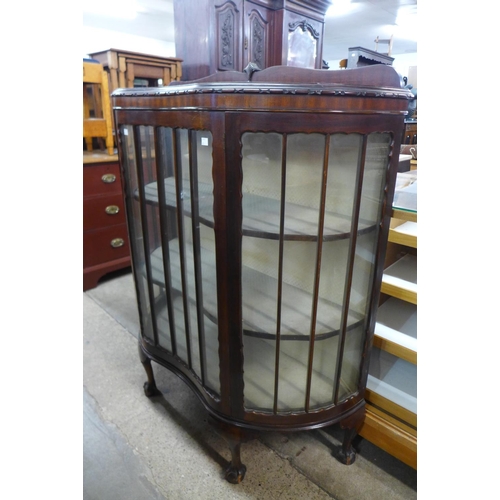 220 - A mahogany serpentine display cabinet