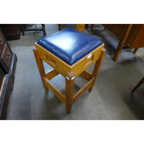 222 - A 1930's Art Deco carved oak counter stool