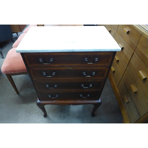 224 - A French inland mahogany and marble topped petit commode