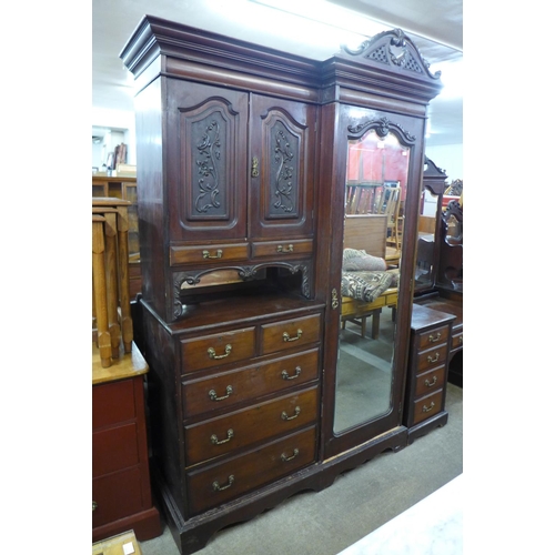 224a - An Edward VII carved mahogany combination wardrobe