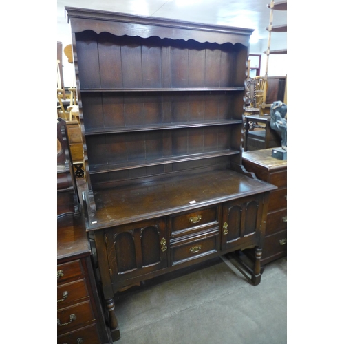 228 - A carved oak dresser