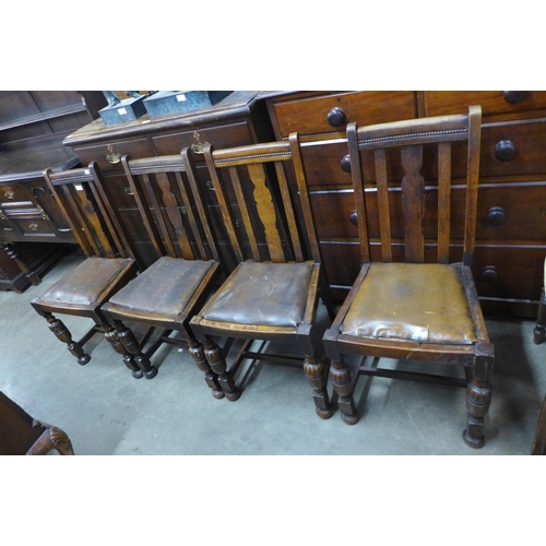 229 - A set of four oak dining chairs