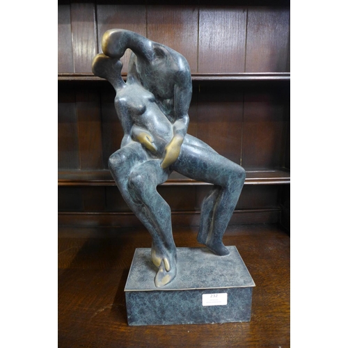 232 - A bronze abstract figure of lovers, 46cms h