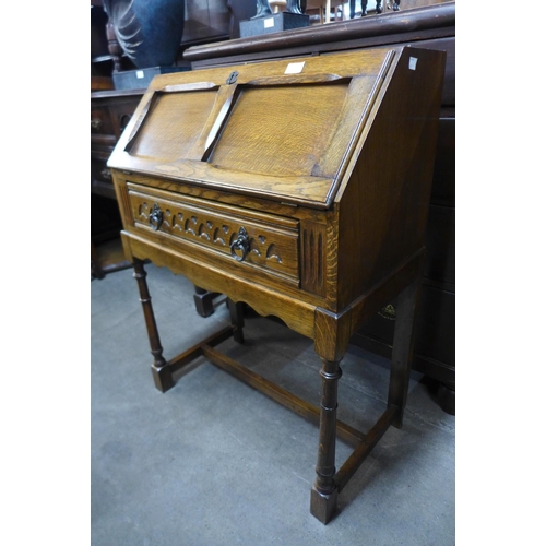 235 - An oak bureau de dame