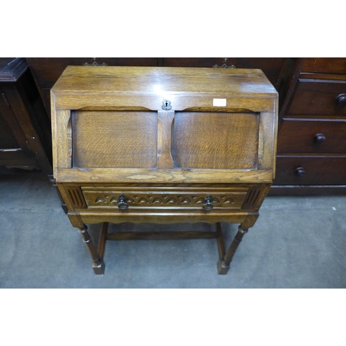 235 - An oak bureau de dame