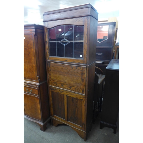 238 - An early 20th Century oak secretaire bookcase