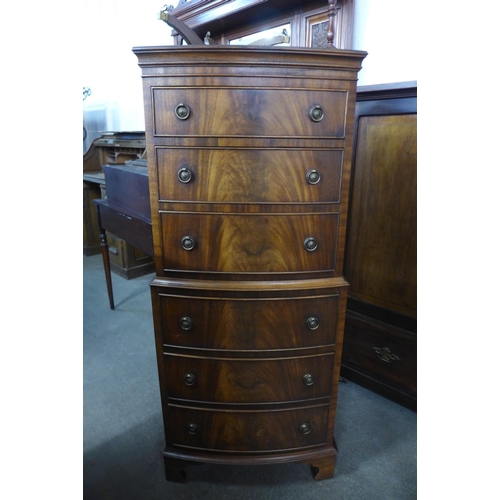 239 - A mahogany bow front chest on chest