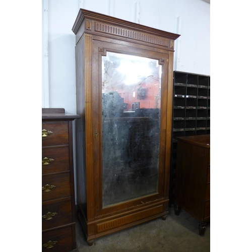 244 - A French fruitwood armoire a/f