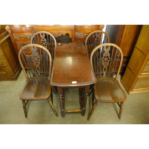 248 - An oak barleytwist gateleg table and four chairs