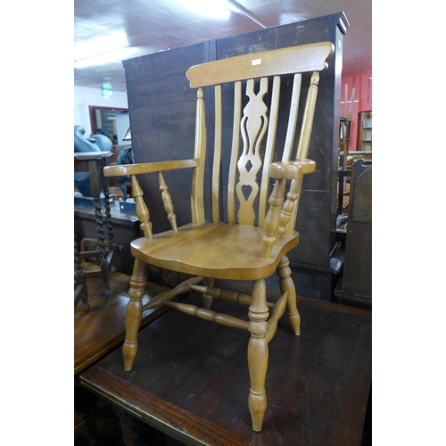 260 - A beech farmhouse armchair