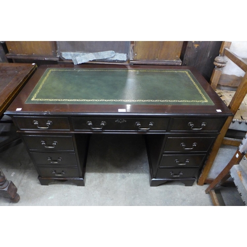 262 - A mahogany and leather insert desk