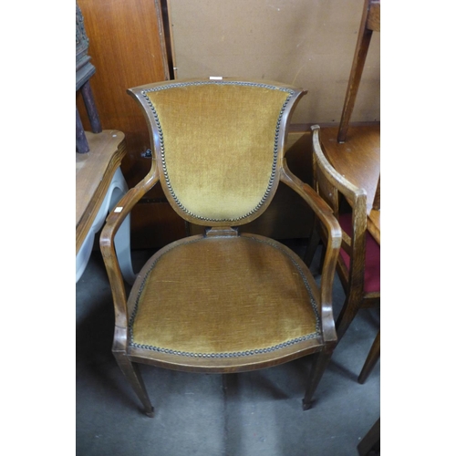 277 - An Edward VII inlaid mahogany and upholstered open armchair