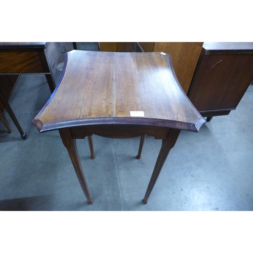 294 - An Arts and Crafts oak occasional table