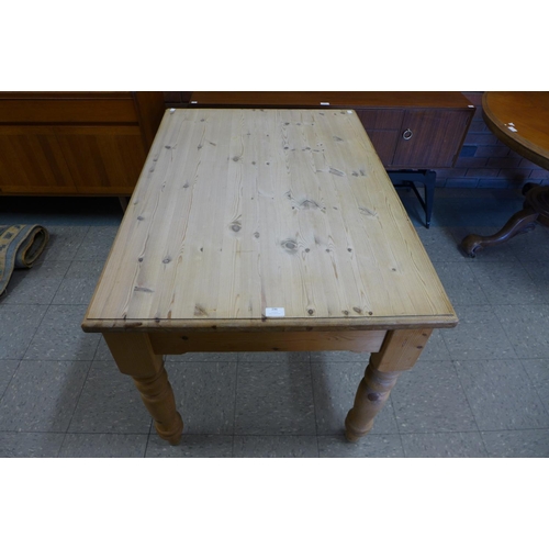 296 - A pine single drawer kitchen table