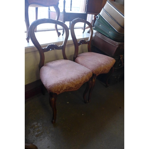 301 - A set of three Victorian walnut balloon back chairs