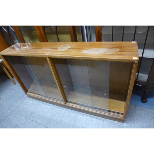 340s - A teak display cabinet, bookcase, coffee table and a china cabinet