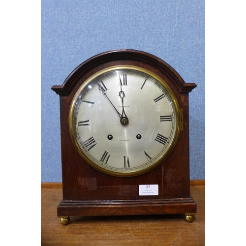 37 - A late 19th Century German oak bracket clock, movement stamped Winterhalter & Hofmeier Sch., 34cm h