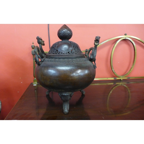 71 - An oriental bronze two handled koro and cover, 45cm h