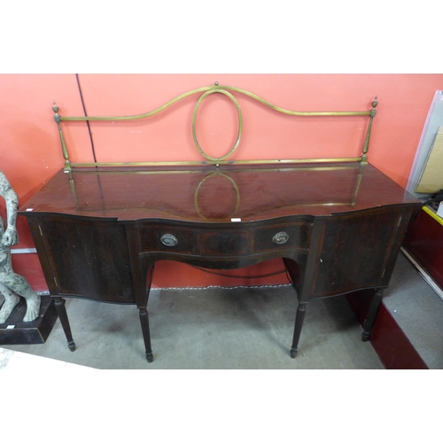 73 - An Edward VII Maple & Co. inlaid mahogany serpentine sideboard