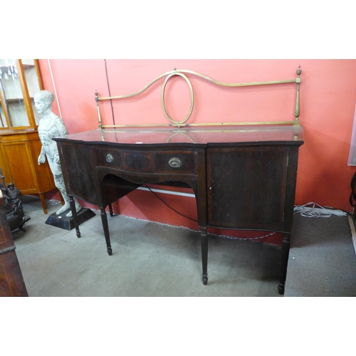 73 - An Edward VII Maple & Co. inlaid mahogany serpentine sideboard