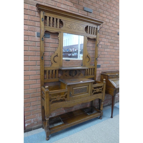 84 - A Victorian carved oak hallstand, 208cms h, 135cms w, 35cms d.