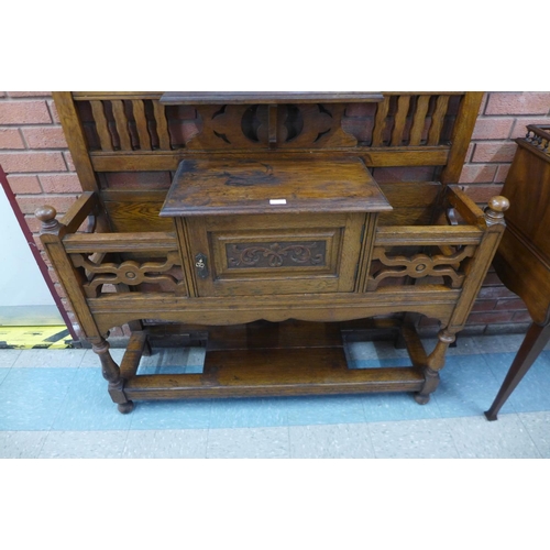 84 - A Victorian carved oak hallstand, 208cms h, 135cms w, 35cms d.