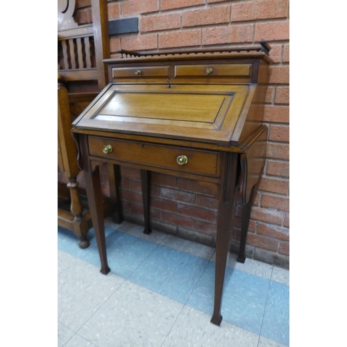 85 - An Edward VII mahogany bureau de dame, 100cms h, 97cms w, 47cms d.