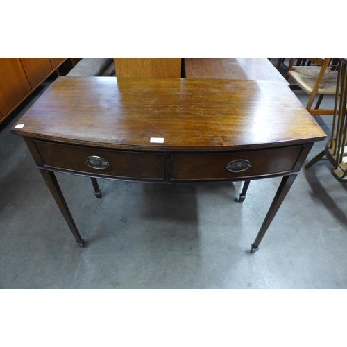 86 - A George III mahogany two drawer bow front side table, 77cms h, 98cms w, 48cms d.