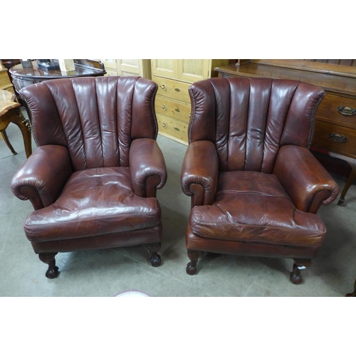 88 - A pair of Tetrad Blake mahogany and chestnut brown leather armchairs