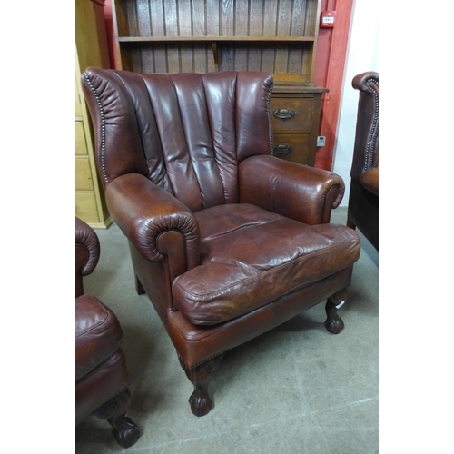 88 - A pair of Tetrad Blake mahogany and chestnut brown leather armchairs