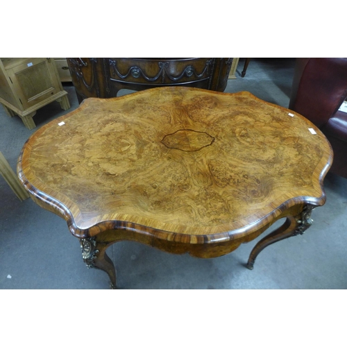 89 - A Victorian burr walnut and ormolu mounted serpentine centre table, 76cms h, 130cms L, 87cms w.