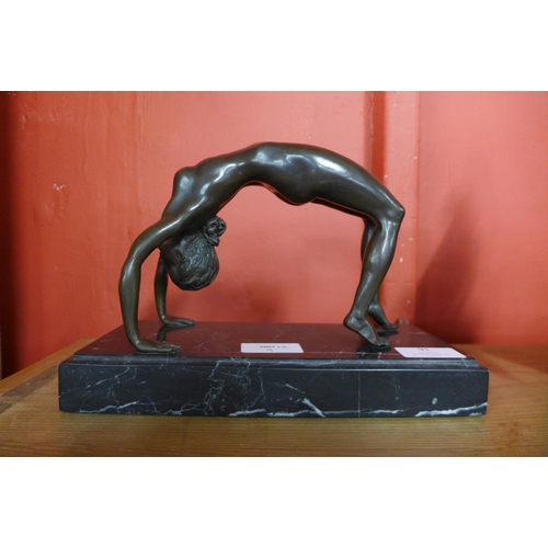 91 - An erotic female bronze sculpture on marble base, 17cms h.