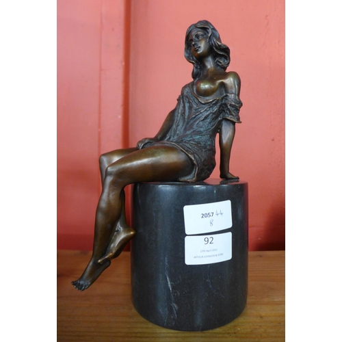 92 - An erotic female bronze sculpture on marble base, 27cms h.