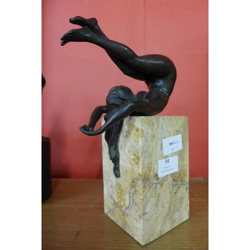 94 - An erotic female bronze sculpture on marble base, 27cms h.