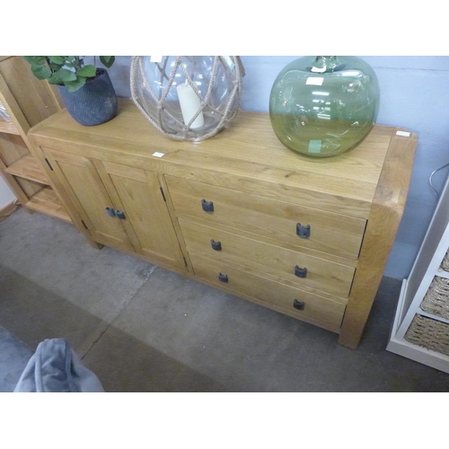 1481 - An oak three drawer, two door sideboard * This lot is subject to VAT - Damaged joint.