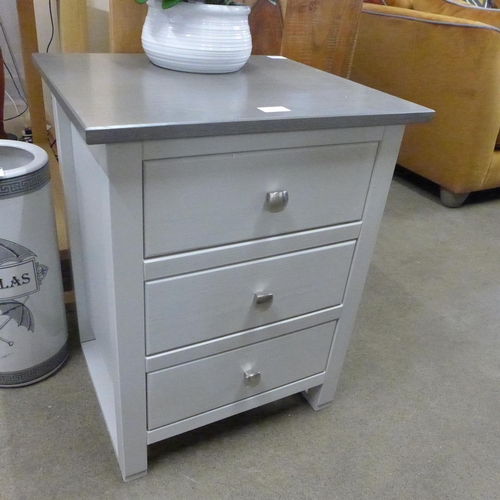 1502 - A grey three drawer bedside chest * This lot is subject to VAT