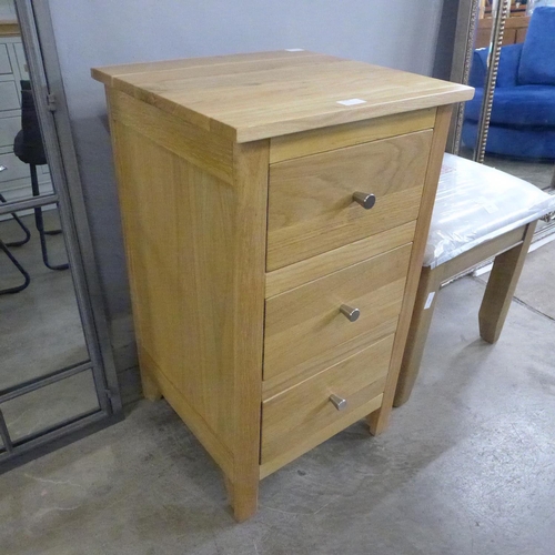 1529 - A three drawer oak bedside chest * This lot is subject to VAT