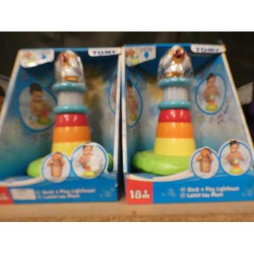 3308 - Four Tomy Stack and Play lighthouses